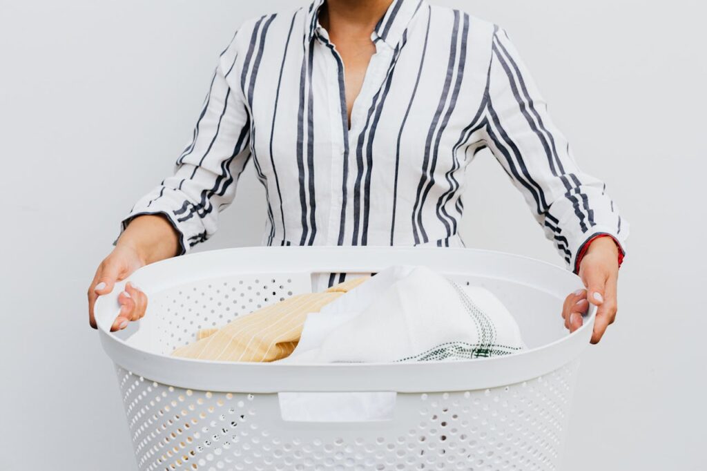 Woman Holding Laundry Basket